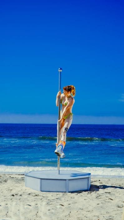 All Star Stages Portable Dance Pole with Dancer on beach on overload colors portrait-2 All Star Stages Portable Dance Pole with Dancer on beach on overload colors portrait-2