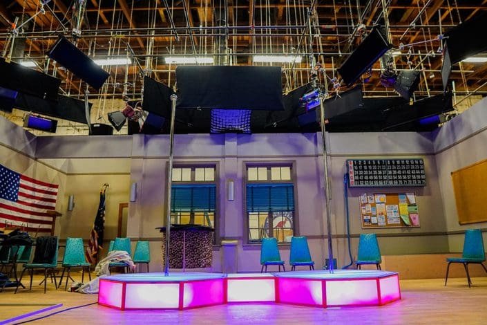 All Star Stages double portable stripper poles and stages connected by catwalk on set of the UpShaws low view 1000px