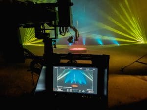 camera screen and action with all star stages portable dance pole and laser lighting on set 1000px