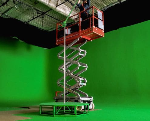 all star stages portable green screen stripper pole secured to lighting grid on green cyc