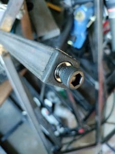 steel square tubing with a bolt in the end
