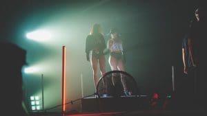 two model prepare a take on an all star stages pedestal platform portable octagon acrylic stage