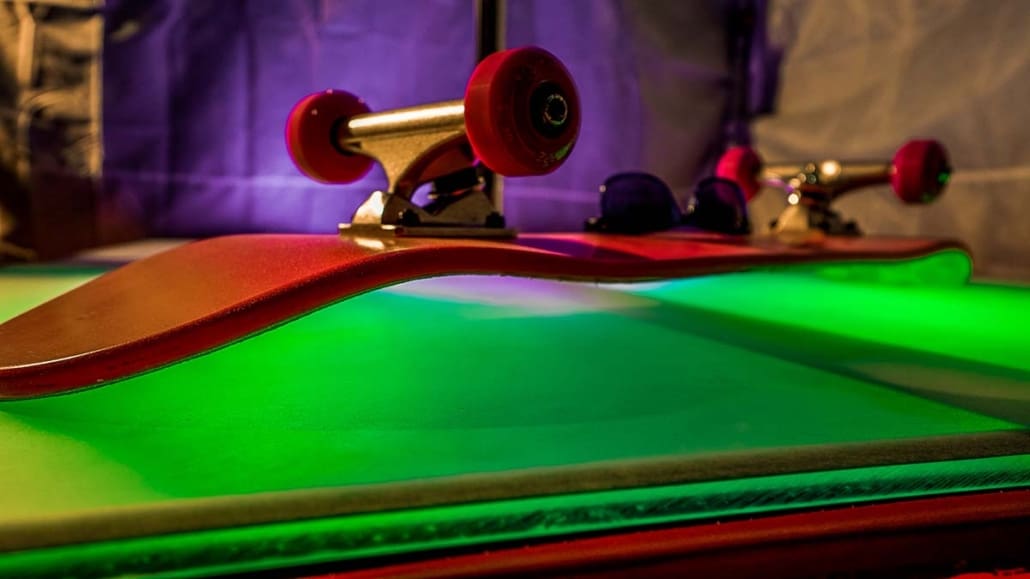 all star stages custom acrylilc glow furniture 6x4 stage with spinning 45mm dance pole and pink skateboard up close with green acrylic glowing