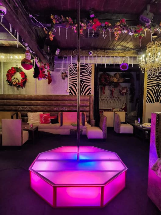 all star stages x 5x5 octo glow stage and pro spinning ceiling free dance pole with pink and green showing