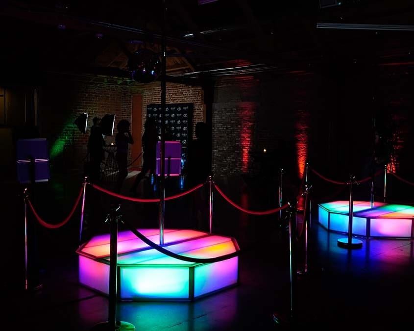 all star stages x stages glowing at an event indoor multi colored