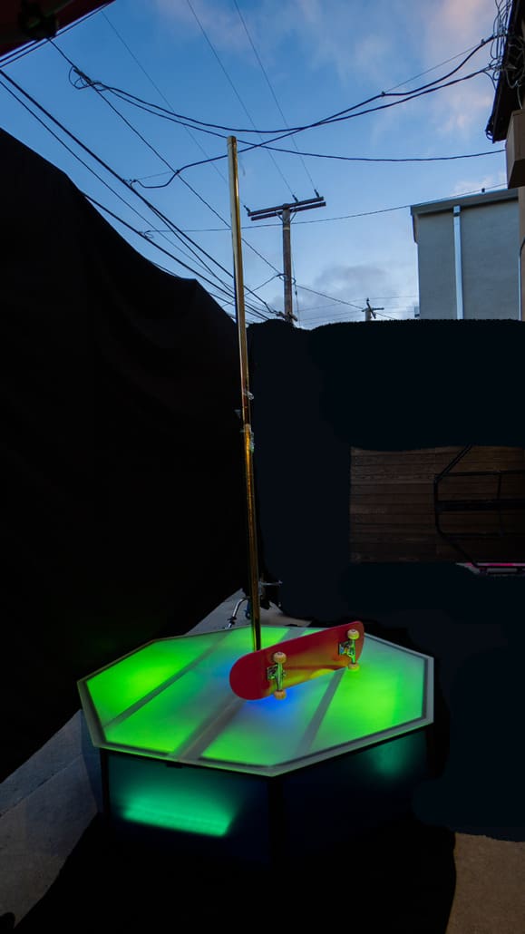 All Star Stages X Brass Lime Green Top Glowing Neon with a skateboard and spinning dance pole on octco stage